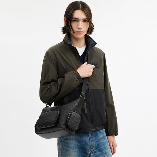 กระเป๋าสะพายข้างผู้ชาย รุ่น Finn Crossbody Bag With Pockets In Signature Canvas