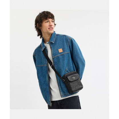 กระเป๋าสะพายข้างผู้ชาย รุ่น Turnlock Crossbody Bag In Signature Canvas