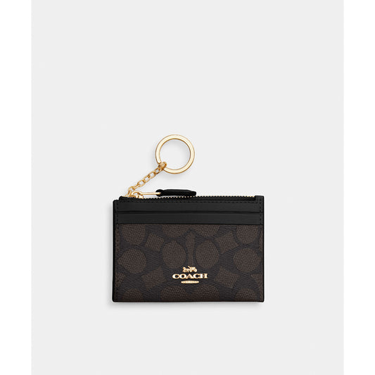 กระเป๋าใส่บัตรผู้หญิง รุ่น Mini Skinny Id Case In Signature Canvas