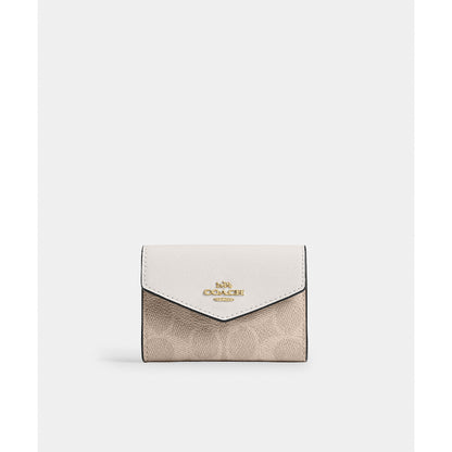 กระเป๋าใส่บัตรผู้หญิง รุ่น Flap Card Case In Signature Canvas