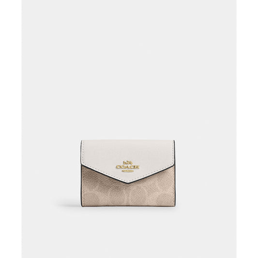 กระเป๋าใส่บัตรผู้หญิง รุ่น Flap Card Case In Signature Canvas