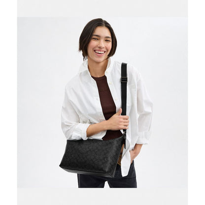 กระเป๋าสะพายข้างผู้ชาย รุ่น Finn Crossbody Bag In Signature Canvas