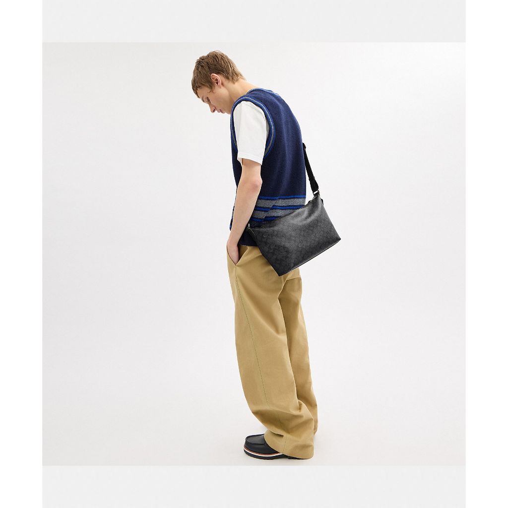 กระเป๋าสะพายข้างผู้ชาย รุ่น Finn Crossbody Bag In Signature Canvas