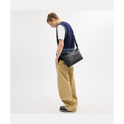 กระเป๋าสะพายข้างผู้ชาย รุ่น Finn Crossbody Bag In Signature Canvas