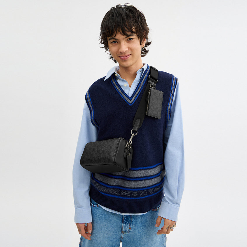 กระเป๋าสะพายข้างผู้ชาย รุ่น Axel Crossbody Bag In Signature Canvas
