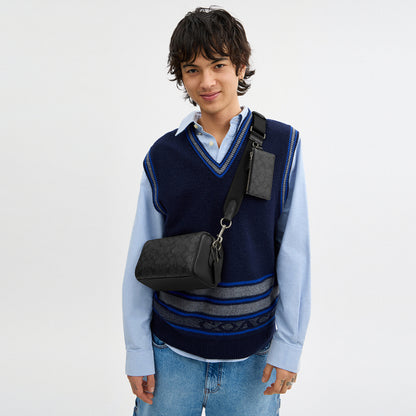กระเป๋าสะพายข้างผู้ชาย รุ่น Axel Crossbody Bag In Signature Canvas
