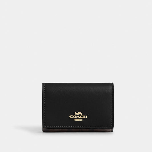กระเป๋าสตางค์ผู้หญิง รุ่น Micro Wallet In Signature Canvas