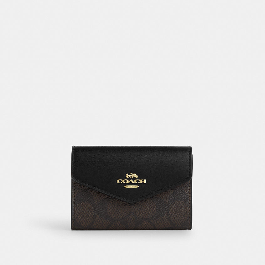 กระเป๋าใส่บัตรผู้หญิง รุ่น Flap Card Case In Signature Canvas