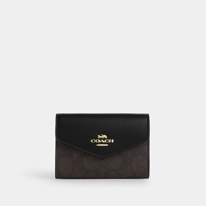 กระเป๋าใส่บัตรผู้หญิง รุ่น Flap Card Case In Signature Canvas