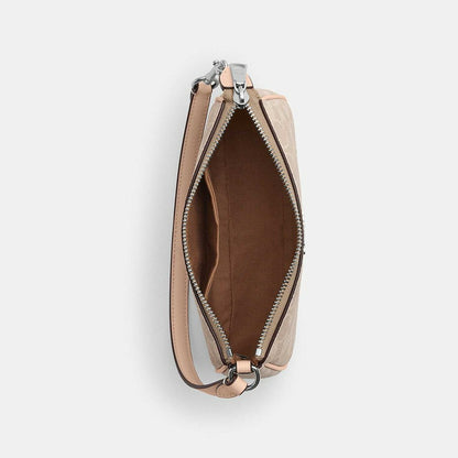 กระเป๋าคล้องมือผู้หญิง รุ่น Nolita 19 In Signature Canvas