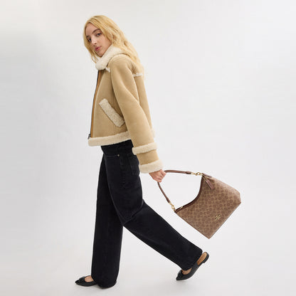 กระเป๋าสะพายผู้หญิง รุ่น Laurel Shoulder Bag In Signature Canvas