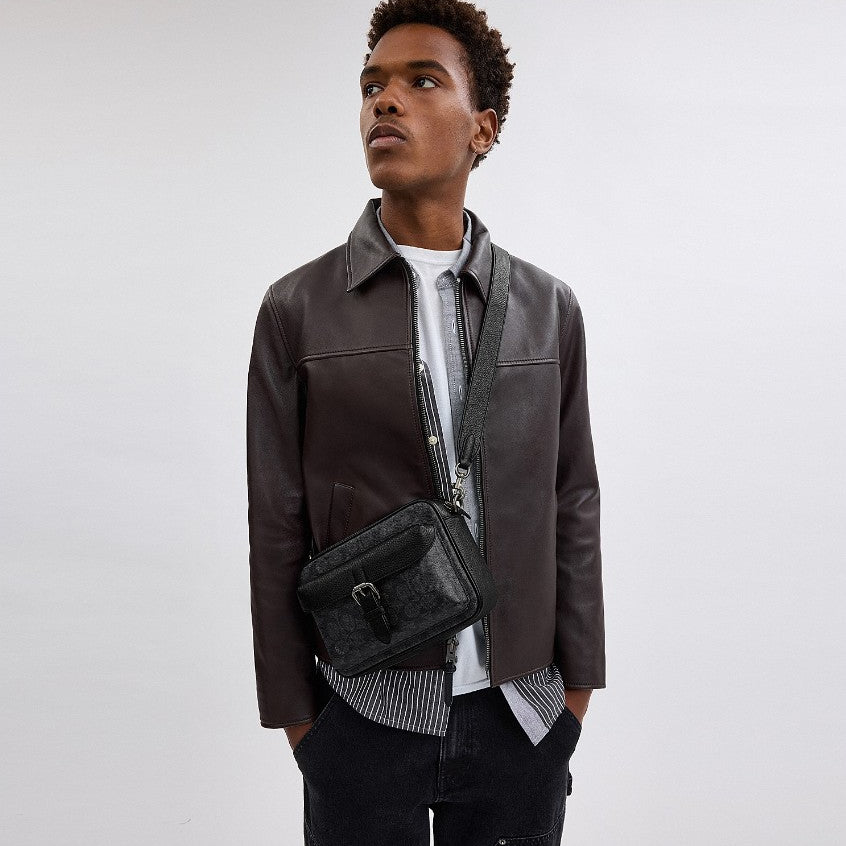 กระเป๋าสะพายข้างผู้ชาย รุ่น Warner Crossbody Bag In Signature Canvas