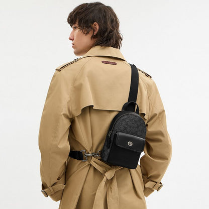 กระเป๋าคาดอกผู้ชาย รุ่น Small Turnlock Sling Pack In Signature Canvas