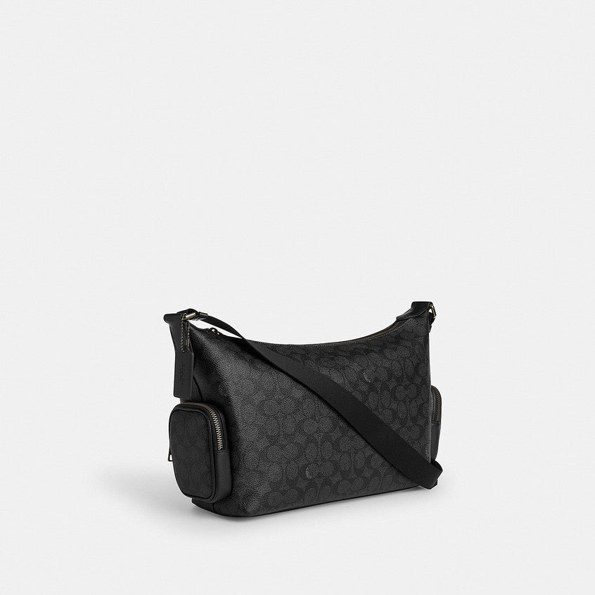 กระเป๋าสะพายข้างผู้ชาย รุ่น Finn Crossbody Bag With Pockets In Signature Canvas