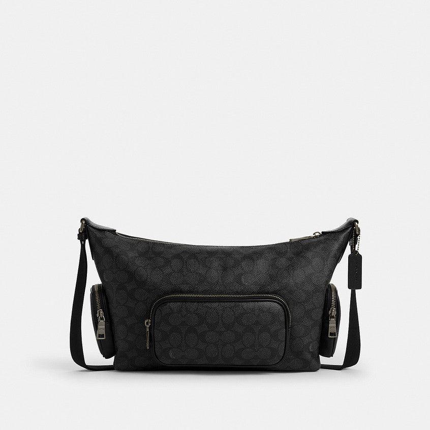 กระเป๋าสะพายข้างผู้ชาย รุ่น Finn Crossbody Bag With Pockets In Signature Canvas