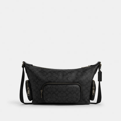 กระเป๋าสะพายข้างผู้ชาย รุ่น Finn Crossbody Bag With Pockets In Signature Canvas