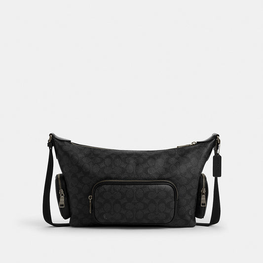 กระเป๋าสะพายข้างผู้ชาย รุ่น Finn Crossbody Bag With Pockets In Signature Canvas