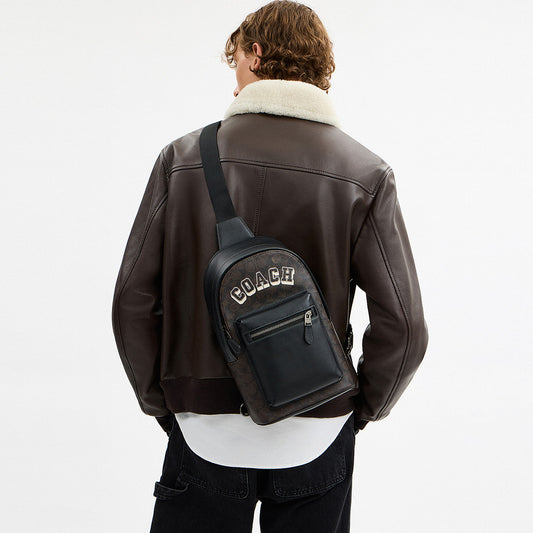 กระเป๋าคาดอกผู้ชาย รุ่น West Pack In Signature Canvas With Varsity Graphic
